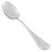 A close-up of a Libbey stainless steel dessert spoon with a silver handle.