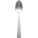 A Libbey stainless steel teaspoon on a white background.