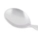 A Libbey stainless steel bouillon spoon with a white handle.