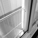 A white coated wire shelf with metal bars.