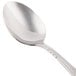 A Libbey stainless steel serving spoon with a silver handle.