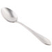 A Libbey stainless steel serving spoon with a silver handle.