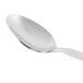 A Libbey stainless steel demitasse spoon with a silver handle.