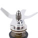 A metal Waring blending assembly with a propeller on top.