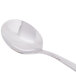 A Libbey stainless steel bouillon spoon with a silver handle.