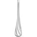 A Libbey stainless steel teaspoon with a curved design on the handle.