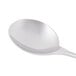 A Libbey stainless steel bouillon spoon with a white handle.