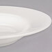 A Libbey ivory porcelain pasta bowl with a wide rim.