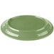 A green porcelain Libbey Cantina platter with a carved design on a white background.