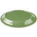 A sage green Libbey porcelain platter with a carved design on a white background.