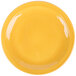 A Libbey Cantina Saffron Porcelain Plate with a wavy rim.