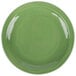 A close-up of a green Libbey Cantina porcelain plate with a wavy design.