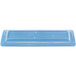 A blue rectangular porcelain tray with a carved surface.