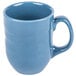 A close-up of a Libbey blueberry carved porcelain mug with a handle.