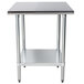 A stainless steel Advance Tabco work table with a galvanized shelf.