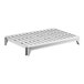 A white plastic shelf with holes on a metal frame.