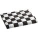 A white rectangular tablecloth with a black and white checkered pattern and elastic edges.