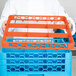 A man holding an orange Carlisle glass rack extender.