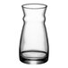 An Arcoroc Fluid carafe with a small amount of liquid in it.