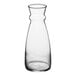 An Arcoroc clear glass carafe with a neck and handle.