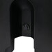 A black circular plastic door with a screw.