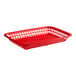 A red rectangular Tablecraft polypropylene fast food basket with holes.