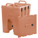 A brown plastic Cambro Camtainer with handles.