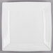 A white square Tuxton china plate with vertical lines on it.