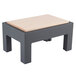 A black and grey table with a wooden top used to display cutting boards.