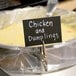 a sign on a bowl of soup