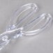 Clear plastic salad tongs.