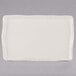 A white rectangular Libbey porcelain tray with a brown border.