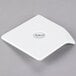 A white square Libbey porcelain plate with a logo on the handle.