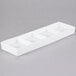 An ultra bright white rectangular porcelain tray with four compartments.