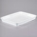 A white rectangular Libbey porcelain pan on a gray surface.
