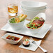 A stack of Libbey ultra bright white Neptune bowls.