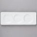 A white rectangular porcelain tray with three wells.