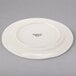 A white porcelain plate with a medium rim.