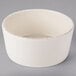A Libbey Farmhouse ivory oatmeal bowl on a gray background.