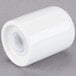 A white porcelain cylinder with a lid and a hole.