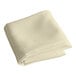 A folded ivory Intedge square table cover.