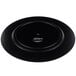 A black circular melamine charger plate with a faux wood design.