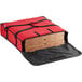 A red Choice insulated pizza delivery bag holding pizza boxes.