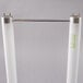 A close up of a Satco HyGrade T8 U-Bend fluorescent light bulb with two white tubes and metal rods.