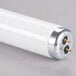 A close-up of a Satco HyGrade 48" Daylight fluorescent tube with white ends.