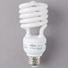 A close-up of a white spiral Satco compact fluorescent light bulb.