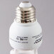 A close up of a Satco Cool White Compact Fluorescent Light Bulb with a silver top.