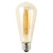 A close-up of a Satco transparent amber LED light bulb with a filament.