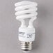 A close up of a white spiral light bulb.