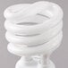 A white spiral Satco light bulb.